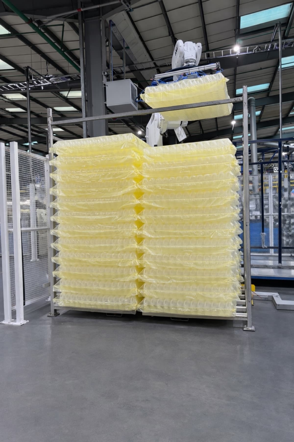 Robot stacking dairy bottles